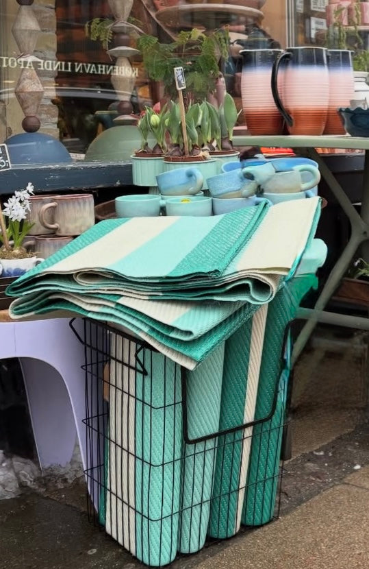 Løber i grøn, blå og råhvid farve