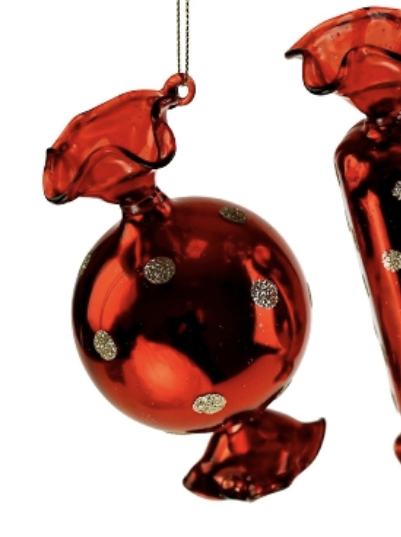 Røde glas bolsjer med prikker